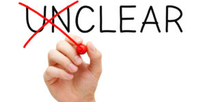 The word "unclear" with "un" crossed out